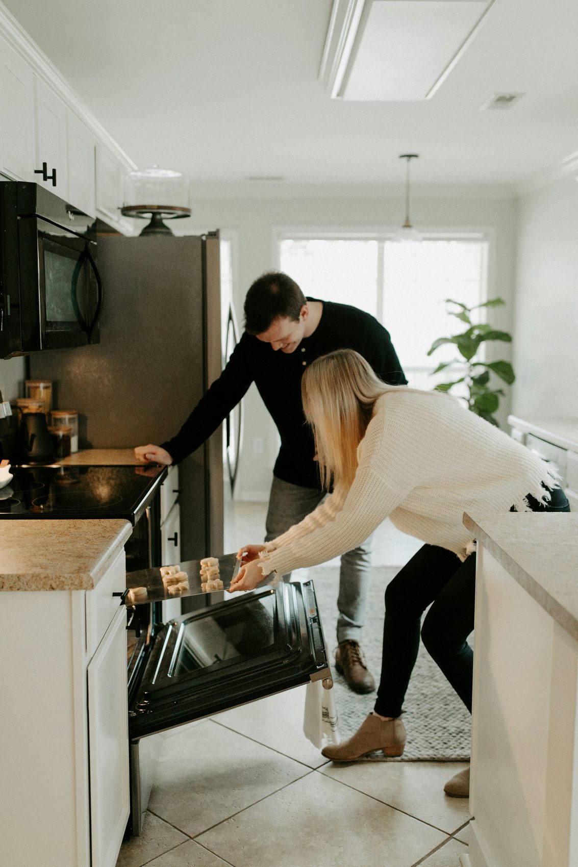 A couple talking in their kitchen